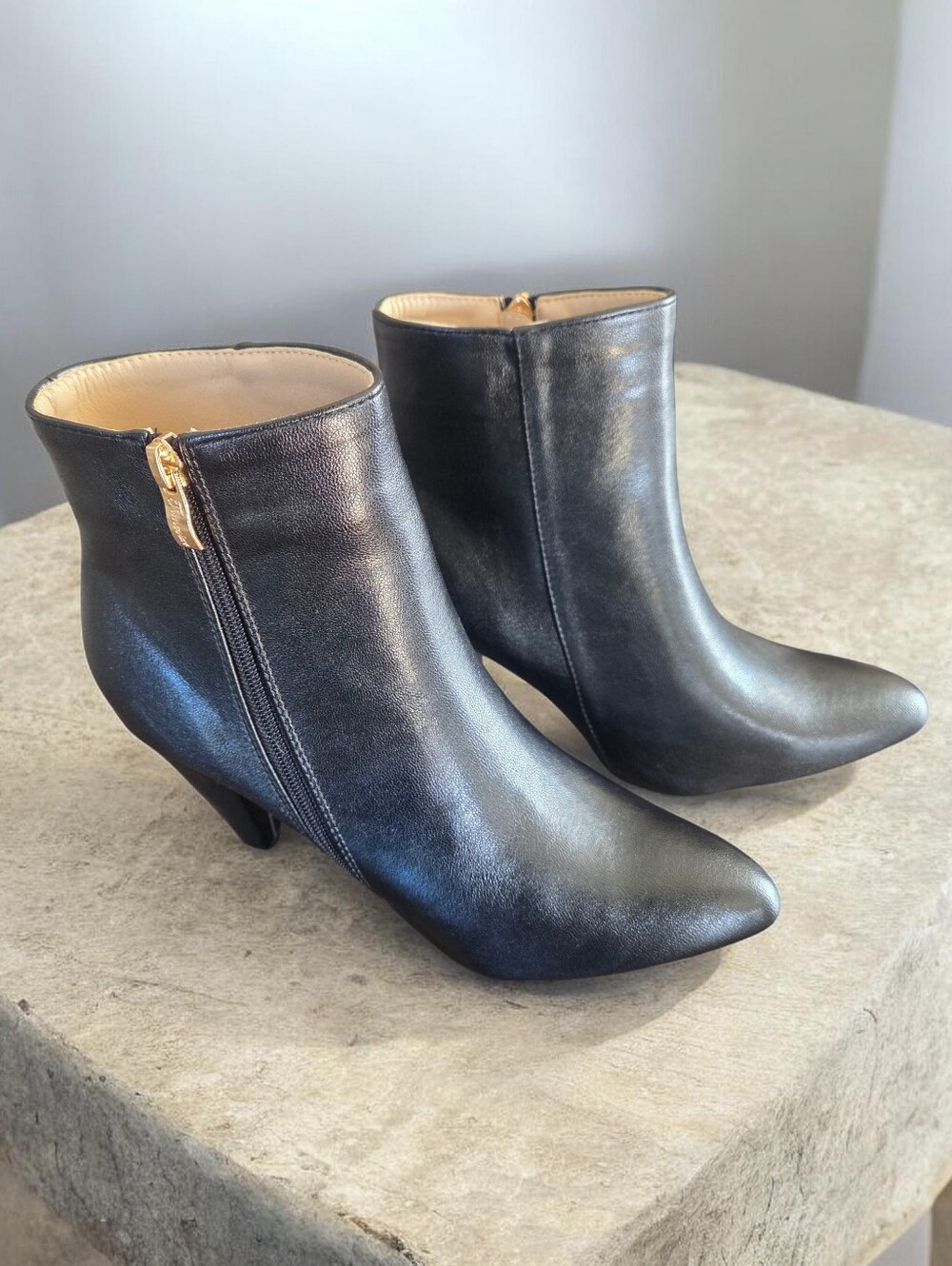 Sleek Black Ankle Boots with Gold Zipper
